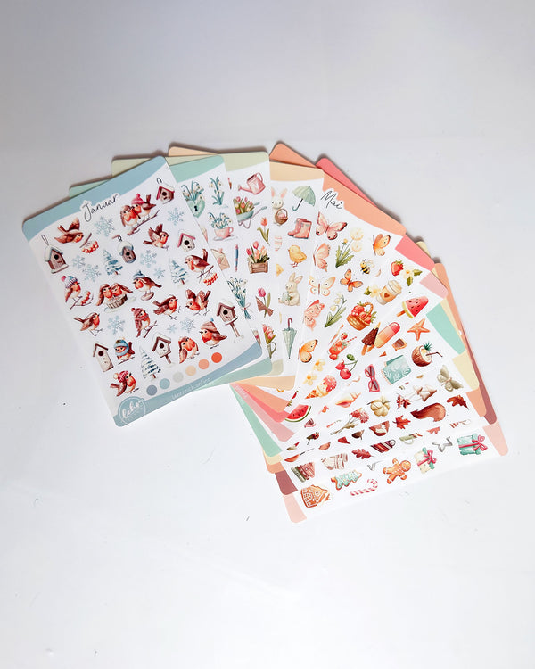 Monatssticker-Bundle mit 12 handgezeichneten Stickerbögen von Januar bis Dezember – saisonale Motive für Schule, Journaling und kreative Klassenzimmermomente.